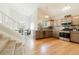 Spacious kitchen featuring stainless steel appliances, modern countertops, and ample cabinet space, with adjacent dining area at 15389 E 99Th Way, Commerce City, CO 80022