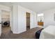 Spacious bedroom with views of the en suite bathroom and laundry room at 16006 E 97Th Pl, Commerce City, CO 80022