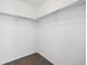 Neutral closet with hanging rack and neutral carpeting at 16006 E 97Th Pl, Commerce City, CO 80022