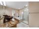 Stylish bathroom with double vessel sinks, a soaking tub, and a glass-enclosed shower at 11053 Meadowvale Cir, Highlands Ranch, CO 80130