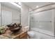 Bathroom featuring vessel sink atop granite counters and a shower/tub enclosure with framed sliding doors at 11053 Meadowvale Cir, Highlands Ranch, CO 80130