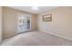 Bright room with plush carpeting and door to balcony at 11053 Meadowvale Cir, Highlands Ranch, CO 80130