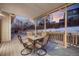 Covered deck with an outdoor dining table and a view of neighboring houses and backyards at 11053 Meadowvale Cir, Highlands Ranch, CO 80130