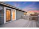 The deck features wood flooring with a neutral gray stain at 11053 Meadowvale Cir, Highlands Ranch, CO 80130