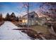 A view of the two story exterior and terraced backyard of the home at 11053 Meadowvale Cir, Highlands Ranch, CO 80130