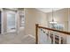 Hallway featuring carpet flooring, white walls, and access to rooms at 11053 Meadowvale Cir, Highlands Ranch, CO 80130