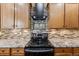 Close-up shot of the kitchen's stainless steel appliances and custom backsplash at 11053 Meadowvale Cir, Highlands Ranch, CO 80130