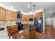 Well-equipped kitchen features granite countertops, an island, and stainless steel appliances at 11053 Meadowvale Cir, Highlands Ranch, CO 80130