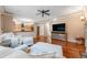 Inviting living room featuring hardwood floors, modern ceiling fan, and adjacent access to the kitchen at 11053 Meadowvale Cir, Highlands Ranch, CO 80130