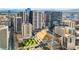 Urban aerial view showcasing the city skyline, including modern high-rise buildings and green spaces below at 1891 Curtis St # 1812, Denver, CO 80202