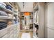 Walk-in closet with custom shelves, drawers, and ample storage at 1891 Curtis St # 1812, Denver, CO 80202