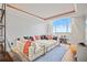 Bright living room with large sectional sofa, hardwood floors, and a stunning city view from expansive windows at 1891 Curtis St # 1812, Denver, CO 80202