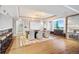 Spacious living room boasting a bar, dining area, hardwood floors and plenty of natural light at 1891 Curtis St # 1812, Denver, CO 80202