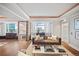 Bright living room with a view, featuring hardwood floors and stylish, neutral décor at 1891 Curtis St # 1812, Denver, CO 80202