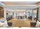 Spacious living area boasting a bar, dining area, and hardwood floors throughout at 1891 Curtis St # 1812, Denver, CO 80202