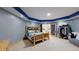 Basement bedroom with stylish lighting, log-style bed and easy access to basement amenities at 974 Spring Ranch Dr, Golden, CO 80401