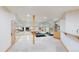 Bright basement gym featuring a mirrored wall, wood floor, exposed support beams and exercise equipment at 974 Spring Ranch Dr, Golden, CO 80401
