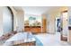 Bright bathroom featuring marble counters, dual sinks, and a large walk-in closet at 974 Spring Ranch Dr, Golden, CO 80401