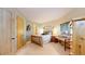 Bedroom with rustic wooden bed frame, a desk by the window, and a cozy feel at 974 Spring Ranch Dr, Golden, CO 80401