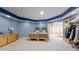 Basement bedroom with two beds, a dresser, and an adjacent game area at 974 Spring Ranch Dr, Golden, CO 80401