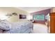 Comfortable bedroom featuring a large window with outdoor views and unique decor at 974 Spring Ranch Dr, Golden, CO 80401