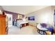 Spacious bedroom featuring a comfortable chair, floral bedding, and natural light at 974 Spring Ranch Dr, Golden, CO 80401