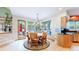 Bright dining area features large windows, hardwood floors, and stylish furnishings at 974 Spring Ranch Dr, Golden, CO 80401