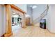 A grand foyer with hardwood floors, high ceilings and a wooden staircase at 974 Spring Ranch Dr, Golden, CO 80401