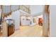 Open foyer featuring hardwood floors, a grand staircase, and a fish tank at 974 Spring Ranch Dr, Golden, CO 80401