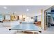 Spacious game room featuring a ping pong table, kitchenette, and a workout area at 974 Spring Ranch Dr, Golden, CO 80401