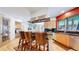 Kitchen featuring hardwood floors, stainless steel appliances, and a functional island with seating at 974 Spring Ranch Dr, Golden, CO 80401