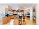 Modern kitchen with stainless steel appliances, a large island, and custom cabinetry at 974 Spring Ranch Dr, Golden, CO 80401