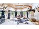 Unique living room with beamed ceilings and many windows at 974 Spring Ranch Dr, Golden, CO 80401