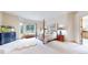 Spacious main bedroom featuring a bay window with seating and a four-poster bed at 974 Spring Ranch Dr, Golden, CO 80401