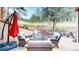 Cozy outdoor patio with wicker furniture and fire pit, surrounded by lush greenery at 974 Spring Ranch Dr, Golden, CO 80401