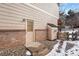 Backyard with exterior access and snow on ground at 89 Dawn Heath Cir, Littleton, CO 80127