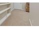 Finished basement with built-in shelving at 89 Dawn Heath Cir, Littleton, CO 80127