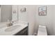 Elegant powder room with a modern vanity and toilet at 89 Dawn Heath Cir, Littleton, CO 80127