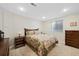 Basement bedroom with floral bedding and dresser at 89 Dawn Heath Cir, Littleton, CO 80127