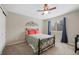 Cozy bedroom with a bed, ceiling fan and window at 89 Dawn Heath Cir, Littleton, CO 80127