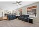 Gathering room with a view to the kitchen and access to a back deck at 89 Dawn Heath Cir, Littleton, CO 80127