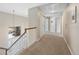 Upstairs hallway with carpet and access to bedrooms at 89 Dawn Heath Cir, Littleton, CO 80127