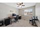 Bright home office features a desk, window, and ceiling fan at 89 Dawn Heath Cir, Littleton, CO 80127