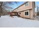 Back of house showing a two story home and deck at 89 Dawn Heath Cir, Littleton, CO 80127