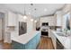 Bright kitchen with ample cabinetry and an island at 89 Dawn Heath Cir, Littleton, CO 80127