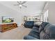 Spacious living room with comfortable seating and a view into the kitchen at 89 Dawn Heath Cir, Littleton, CO 80127