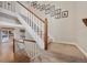 View of staircase with wood and white railings at 89 Dawn Heath Cir, Littleton, CO 80127