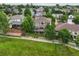 Aerial view of neighborhood and home with large deck, backyard, and greenbelt at 15962 W 70Th Dr, Arvada, CO 80007