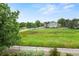 Backyard view overlooking greenbelt with mature trees and views of the neighborhood at 15962 W 70Th Dr, Arvada, CO 80007