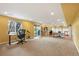 Spacious basement with carpet, tile, and a walk out to the backyard at 15962 W 70Th Dr, Arvada, CO 80007